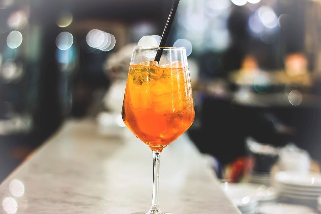A cocktail being finished at the bar